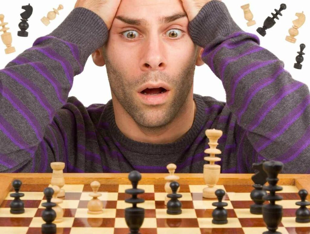 A man analyzing a chess game
