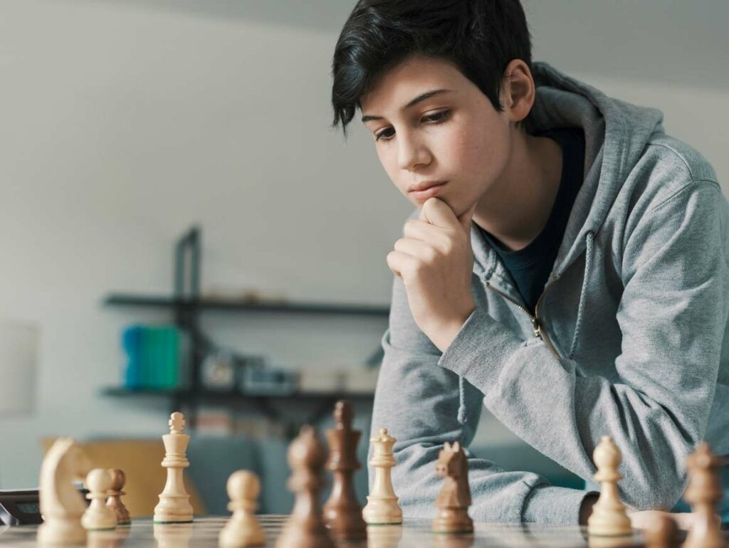 teenager playing chess