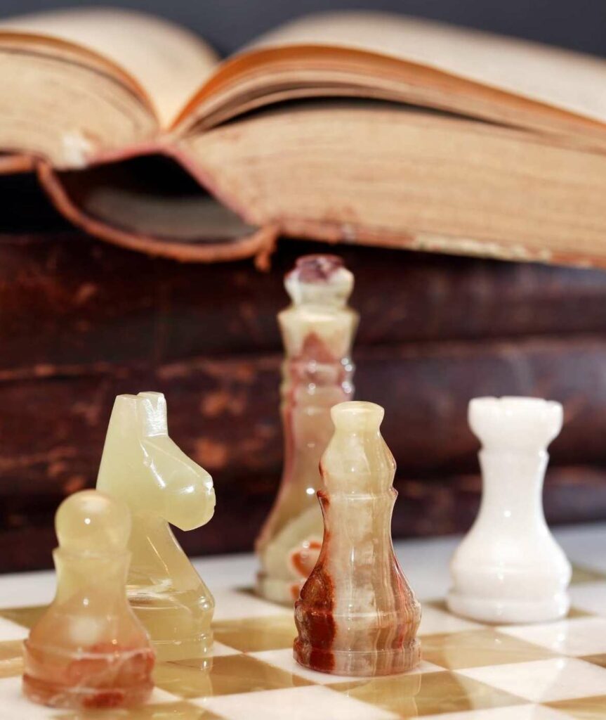 Fide rule book and chess pieces