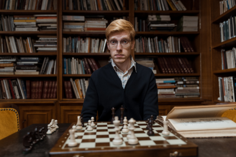 A Chess grandmaster at a chess board