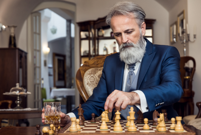distinguished man playing chess